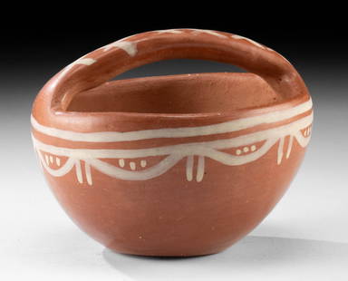 Santa Clara Pueblo Redware Pottery Basket-Bowl: **Originally Listed At $200** Native American, Southwestern United States, Santa Clara Pueblo, ca. mid to late 20th century CE. A redware basket style bowl with a handle, the surface painted with whit
