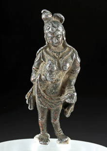 Rare Gandharan Copper Figure Bare-Breasted Goddess: Ancient Central Asia, Pakistan, Gandhara, ca. 1st century CE. A remarkably rare copper lead alloy figure of a voluptuous, bare-breasted goddess adorned in drapery, bangles, and anklets as she holds bi