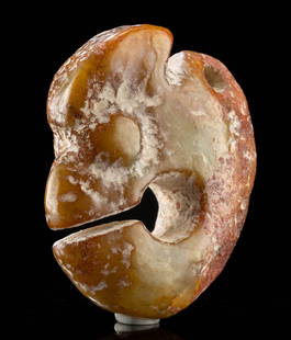 Chinese Neolithic Hongshan Nephrite Jade Pig Dragon: East Asia, Northeastern China, Neolithic period, Hongshan culture, ca. 4700 to 2900 BCE. A hand-carved nephrite jade amulet in the form of an abstract zoomorphic figure, often referred to as a "pig dr