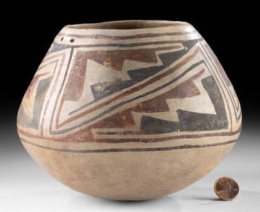 Casas Grandes Villa Ahumada Polychrome Jar: Pre-Columbian, Mexico, Chihuahua, Casas Grandes, Villa Ahumada type, ca. 1350 to 1450 CE. A hand-built pottery jar of round form with a sloped shoulder and a petite base. Adorning the beige-ground ext