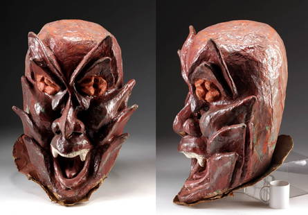 1980s African Papier-Mache Carnival Mask Devil: West Africa, Guinea-Bissau, ca. 1980s CE. A massive papier-mache carnival mask, crafted for pre-Lenten spring parades - a vibrant cultural tradition that blends local creativity with festive exuberanc