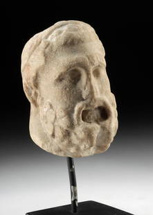 Roman Marble Portrait Head - Hercules Type with Beard: Rome, Imperial Period, ca. 1st to 2nd century CE. A weathered yet powerfully expressive marble head depicting a bearded male, likely Hercules, carved in high relief with thick, curling facial hair and