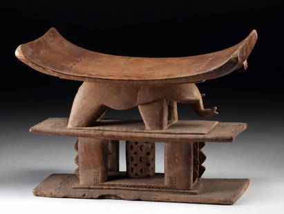 African Asante Carved Wooden Elephant Dwa Stool: West Africa, Ghana, Asante (Ashanti) people, ca. early 20th century CE. A finely carved stool, skillfully hewn from a single piece of wood, composed of two distinct tiers. The lower tier consists of a