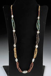 Ancient Egyptian Faience Bead Necklace + Rock Crystals: Ancient Near East or Egypt, ca. 1st millennium BCE. A beautifully arranged necklace of ancient faience beads, features alternating 3 strand segments of turquoise, black, red, and beige hues, intersper