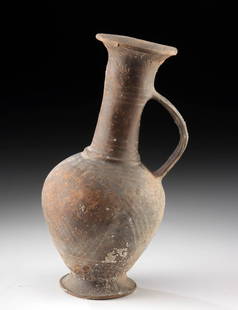Cypriot Pottery Bilbil - Poppy Form Vessel: Greece, Cyprus, Late Bronze Age, ca. 1500 to 1250 BCE. A beautifully crafted Cypriot bilbil, this Late Bronze Age vessel displays a gently slanted silhouette that adds distinct character to its otherw