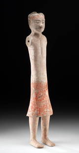 Chinese Han Pottery Stick Figure - Red Skirt Male: East Asia, China, Han Dynasty, ca. 206 BCE to 220 CE. A slender sentinel from the tombs of ancient China, this pottery 'stick figure' embodies the elegance and simplicity of Han Dynasty funerary art.