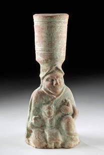 Chinese Han Dynasty Pottery Lamp - Figure Holding Child: East Asia, China, Han Dynasty, ca. 206 BCE to 220 CE. An earthenware oil lamp or candlestick holder from a tomb, shaped as a kneeling adult figure cradling a child in their lap. A cylindrical socket a