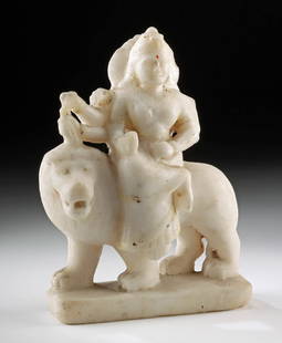 Indian Marble Sculpture of Durga Riding Lion Vahana: South Asia, India, ca. 20th century CE. A remarkable hand-carved marble statue of Durga, the Hindu goddess of war, depicted sitting upon a lion - her vahana or sacred mount - with several outstretched