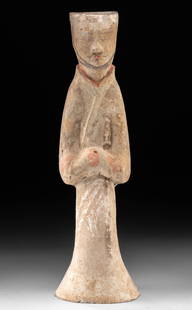 Han Dynasty Pottery Figure - Tall Standing Attendant: East Asia, China, Han Dynasty, ca. 206 BCE to 220 CE. A tall and stately presence in earthen clay, this Han dynasty pottery figure evokes the ceremonial stillness of an eternal court. Sculpted in a sl