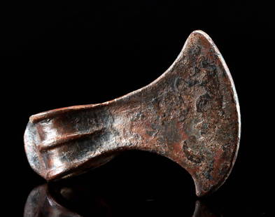 Luristan Bronze Axe - Early Iron Age Weapon: Ancient Near East / Central Asia, Northwestern Iran to Eastern Turkey, Luristan culture, ca. 1200 to 800 BCE. A cast bronze axe head featuring a flared crescent blade and reinforced socket designed fo