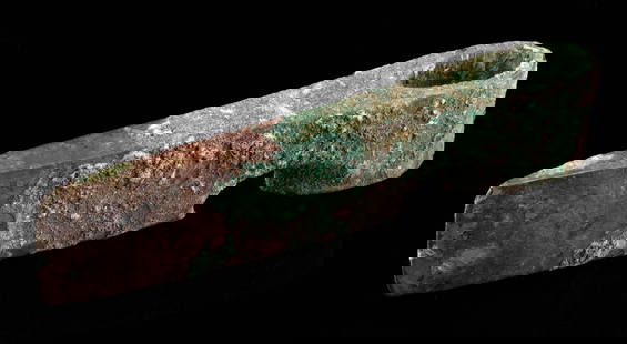 Canaanite Bronze Age Socketed Axe Head: Ancient Near East, the Levant, Canaan, Middle Bronze Age, ca. 1950 to 1539 BCE. A finely cast leaded bronze axe head featuring a robust ovoid socket for hafting and a wide rectangular blade. The subst