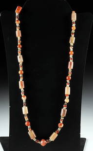 Egyptian Faience & Carnelian / Agate Bead Necklace: Near East, Mesopotamia / Egypt, New Kingdom to Roman Period, ca. 1550 BCE to 300 CE. A resplendent necklace composed of an array of ancient beads fashioned from carnelian, agate, chalcedony, and Egypt