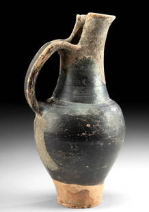 Etruscan Beaked Oinochoe, ex-Harmer Rooke: Classical World, northern/central Italy, Etruria, Etruscan culture, ca. 4th century BCE. An elegant, wheel-thrown, pottery oinochoe of a tall and graceful form exhibiting an annular foot, an inverted
