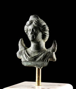 Roman Bronze Bust - Crescent Moon God Men: Roman, Imperial period, Eastern Empire, ca. 1st to 3rd century CE. A rare and evocative leaded bronze bust of the Anatolian moon god Men, shown with stylized facial features, softly parted hair, and a