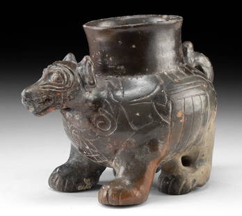 Maya-Toltec Plumbate Vessel - Dog or Coyote Effigy: Pre-Columbian, Southern Mesoamerica, Maya-Toltec horizon, ca. 900 to 1200 CE. An adorable and compact plumbate effigy vessel in the form of a stout four-legged canid - either a dog or coyote - modeled