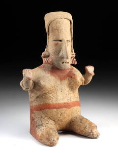 Pre-Columbian Jalisco Pottery Seated Female Figure: Pre-Columbian, West Mexico, Jalisco, ca. 200 BCE to 300 CE. A hand-built and hollow terracotta figure representing a seated female, rendered in the expressive style associated with the shaft tomb trad