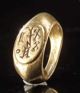 4th C. South Arabian Gold Ring - Ammi-Dhakhurat Watar: Southern Arabia, Himyarite Kingdom, ca. 4th to 5th century CE. A striking example of ancient Arabian regalia, this solid 21.6 karat gold signet ring bears an inscription of lasting power and identity.