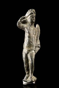 Ancient Roman Bronze Standing Figure - Hercules Finial: Roman Empire, ca. 1st to 3rd century CE. A small, solid-cast bronze figure rendered in a standing pose, possibly depicting Hercules holding his club, and likely once serving as a decorative finial or