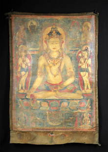 Tibetan Textile Thangka of Ratnasambhava, Jina Buddha: Central Asia, Tibet, ca. early 20th century CE. A beautifully hand-painted textile thangka depicting the Jina Buddha Ratnasambhava, rendered in vibrant mineral pigments on canvas and mounted within a