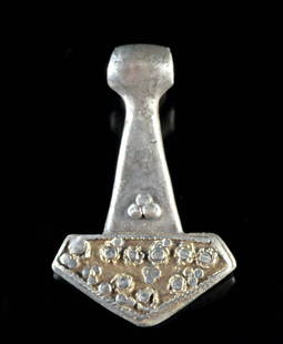 9th C. Viking Gil Silver Thor's Hammer (Mj?lnir): Northern Europe, Scandinavia, Viking Age, ca. 9th to 11th century CE. A powerful emblem of divine protection and martial prowess, this exceptional Viking pendant represents Mj?lnir?the mythic hammer o