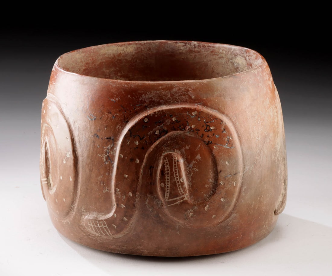 Colima Redware Pottery Drum Vessel w/ Rattlesnakes: Pre-Columbian, West Mexico, Colima culture, ca. 300 BCE to 300 CE. A redware pottery drum or drum-shaped vessel adorned with dynamic low-relief depictions of coiled rattlesnakes encircling the sides.