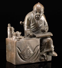 Chinese Brass Figure of a Shopkeeper Counting Profits