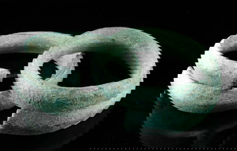 Ancient Vietnamese Dong Son Bronze Coiled Arm Cuffs (pr): Southeast Asia, Vietnam, Dong Son Culture, ca. 500 BCE to 100 CE. A sculptural pair of ancient elegance, these bronze coiled arm cuffs from the Dong Son culture spiral with commanding grace. Each cuff