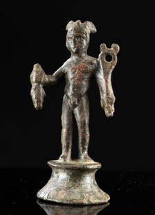 Ancient Roman Leaded Bronze Figure of Mercury Deity: Roman, Imperial Period, ca. 1st to 3rd century CE. A small leaded bronze statuette of the god Mercury (Hermes in the Greek pantheon), portrayed standing nude atop a flared circular base. The youthful