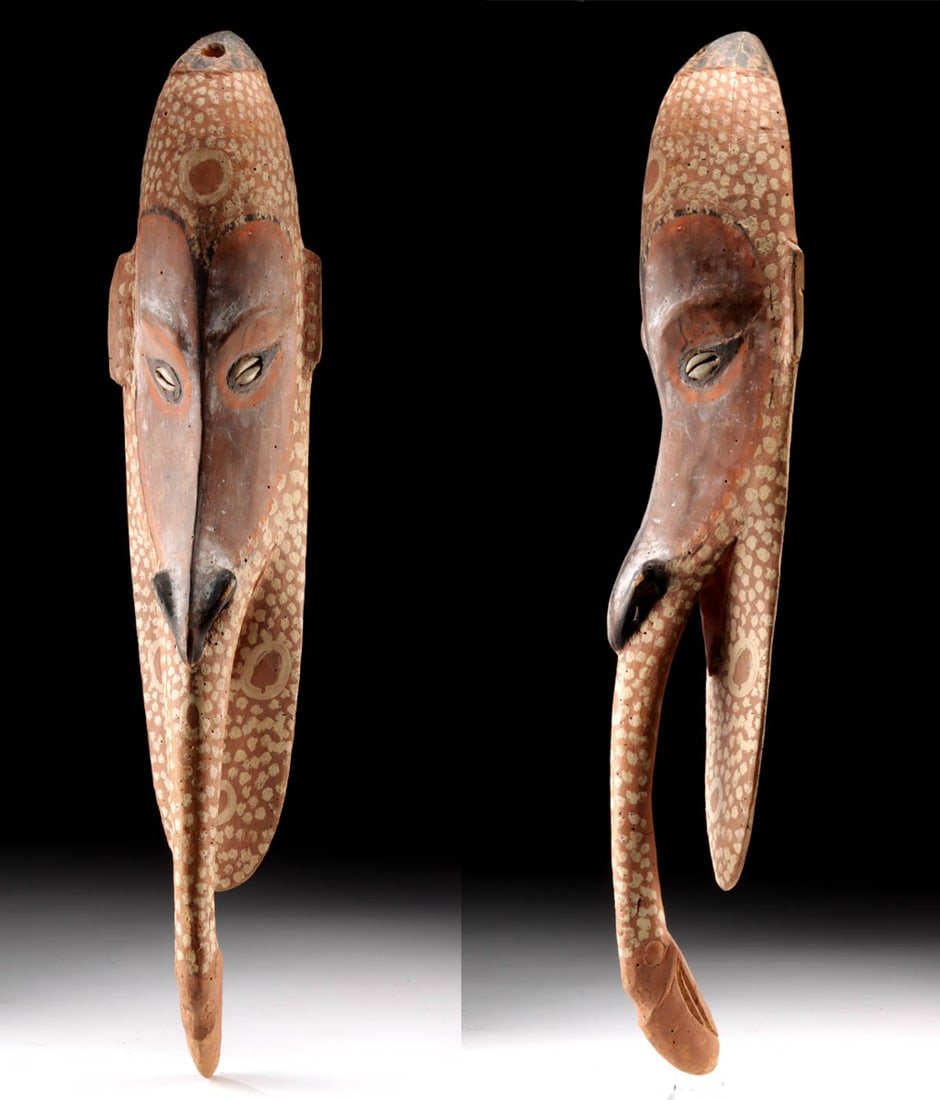 1940s Papua New Guinea Long-Nosed Tambaran Spirit Mask: Oceania, Papua New Guinea, Sepik River, Iatmul People, ca. 1940s CE. A striking long-nosed Tambaran spirit mask from the Iatmul people of the Middle Sepik River region, carved from a single piece of l