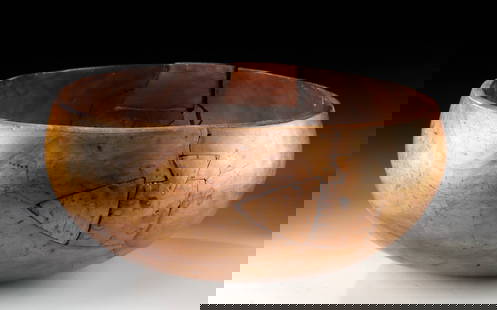 19th C. Native Hawaiian Kou Wood Low Bowl: Oceania, Polynesia, Hawaii, Kanaka Maoli (Native Hawaiian), ca. 19th century CE. A warm, honey-brown Hawaiian low bowl, expertly carved from a single piece of prized kou wood, its smooth surface revea