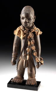 Nigerian Yoruba/Fon Wood Male Shrine Figure: Africa, Yoruba People, Southwestern Nigeria, ca. 1880 to 1910 CE. A powerful carved Yoruba shrine figure, likely associated with the cult of Ogun, the Orisha (deity) of iron, war, and technology. The