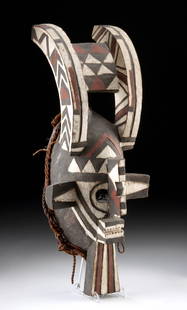Burkina Faso Mande Wood Antelope Bush Spirit Mask: West Africa, Burkina Faso, Mande people, Bobo/Bwa or Marka-Dafing culture, ca. early to mid-20th century CE. A striking wooden mask characterized by tall, curved horns reminiscent of antelope, a ridge