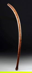19th C. Vanuatu Islands Wood Dueling Club: Oceania, Melanesia, Vanuatu, Malo / Espiritu Santo Islands ca. 19th century CE. A wooden club with a sweeping curve and rounded knob head - a form closely likened to a fencing sabre. The shaft flatten