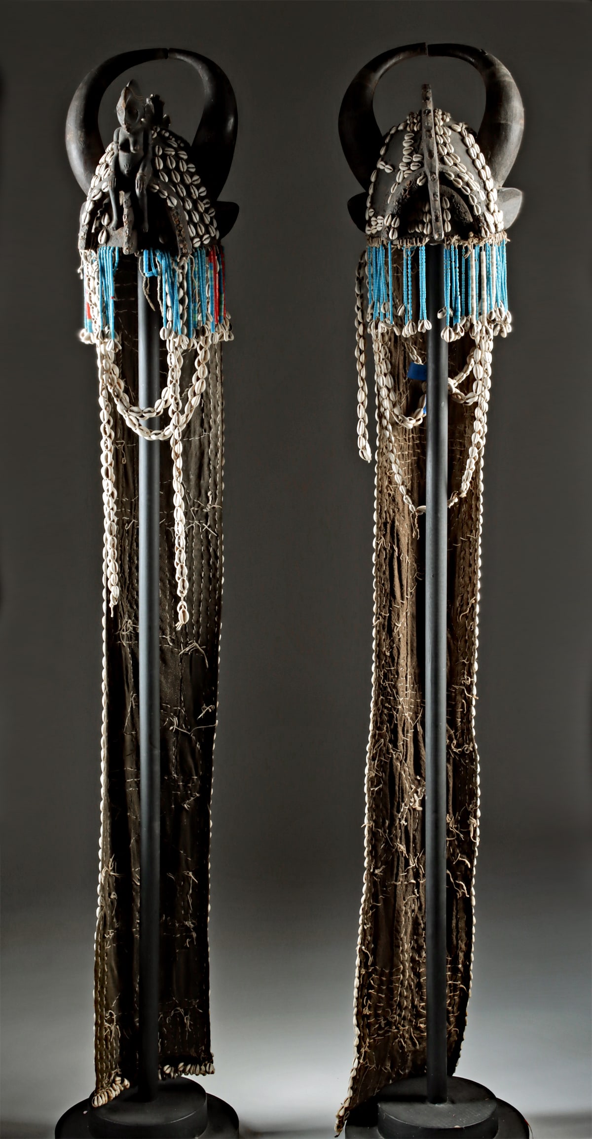 Pair of African Senufo Woman's Initiation Headdresses: West Africa, Ivory Coast, Senufo, ca. early 20th century CE. A pair of women's initiation headdresses, each carved from wood and featuring serrated crests, ear-like projections, and large crescent-sha