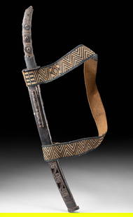 Japan Indigenous Ainu Ritual Sword Mounts & Woven Strap: East Asia, Japan, Ainu culture, ca. 19th to early 20th century CE. All the fittings for a ritual sword - minus the blade - are present and secured to a lacquered wooden scabbard. The sheath features t