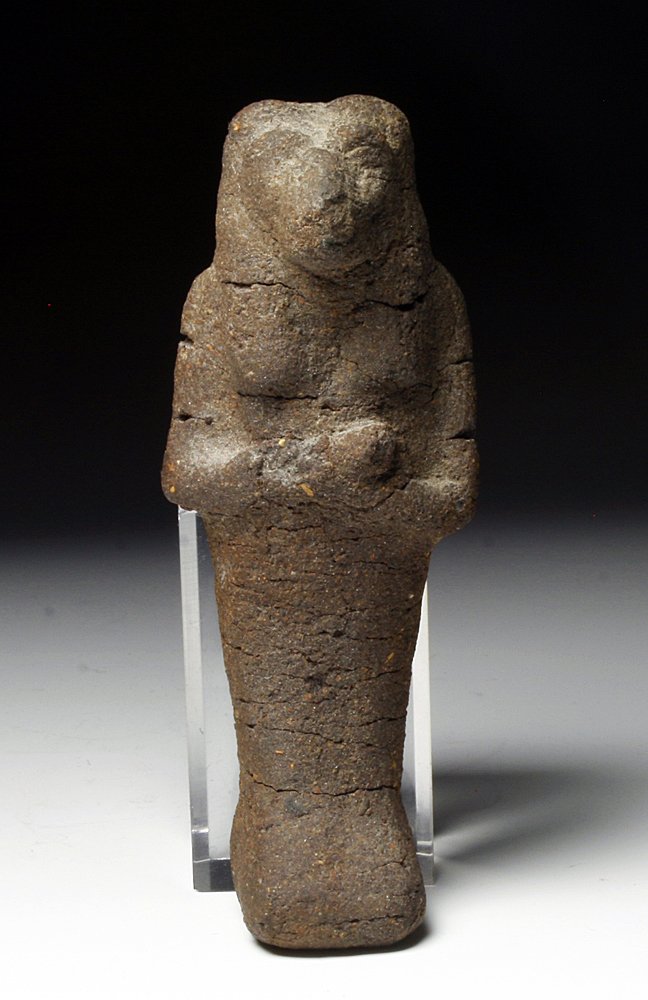 An Egyptian Pseudo-Mummified Thoth: From ancient Egypt, 3rd Intermediate - Late Period, ca. 1075 - 343 BC. A linen and resin mummiform figure of Thoth - the baboon god - to resemble a shabti. Hands held to chest and holding an unknown o