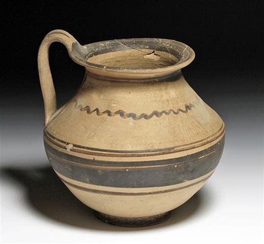 A Large Daunian Olpe - Published: Southeastern Italy, Ca 4th century BCE. Large and attractive Daunian pottery olpe uncovered in a Daunian tomb in 1944 by Byron Farwell, and later (1953) published in a book on his collection. Bulbous 