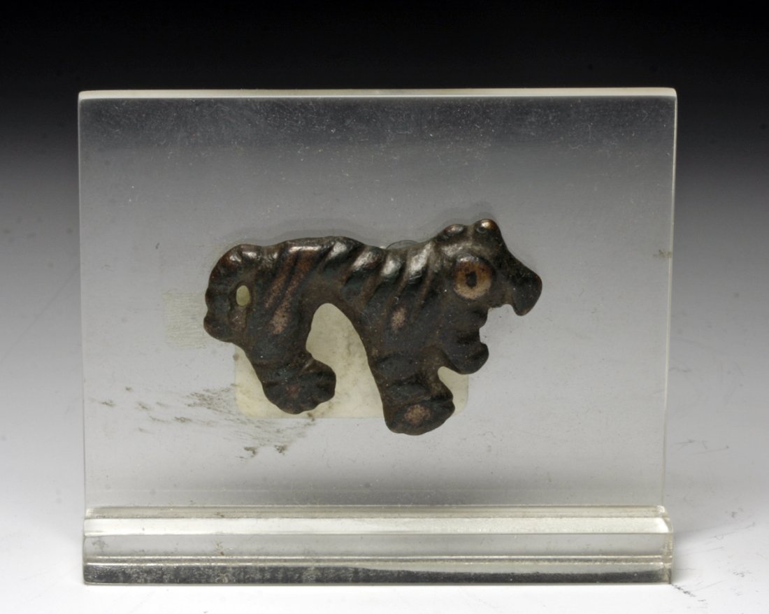 Chinese Han Dynasty Bronze Applique of Tiger: China, Han Dynasty, Ca 220 BCE to 200 CE. Small but quite attractive appliqué in the form of a tiger. Striped body and large round eyes, now with deep brown/green patina. 1-3/8" L. Provenance: Ex-Sar