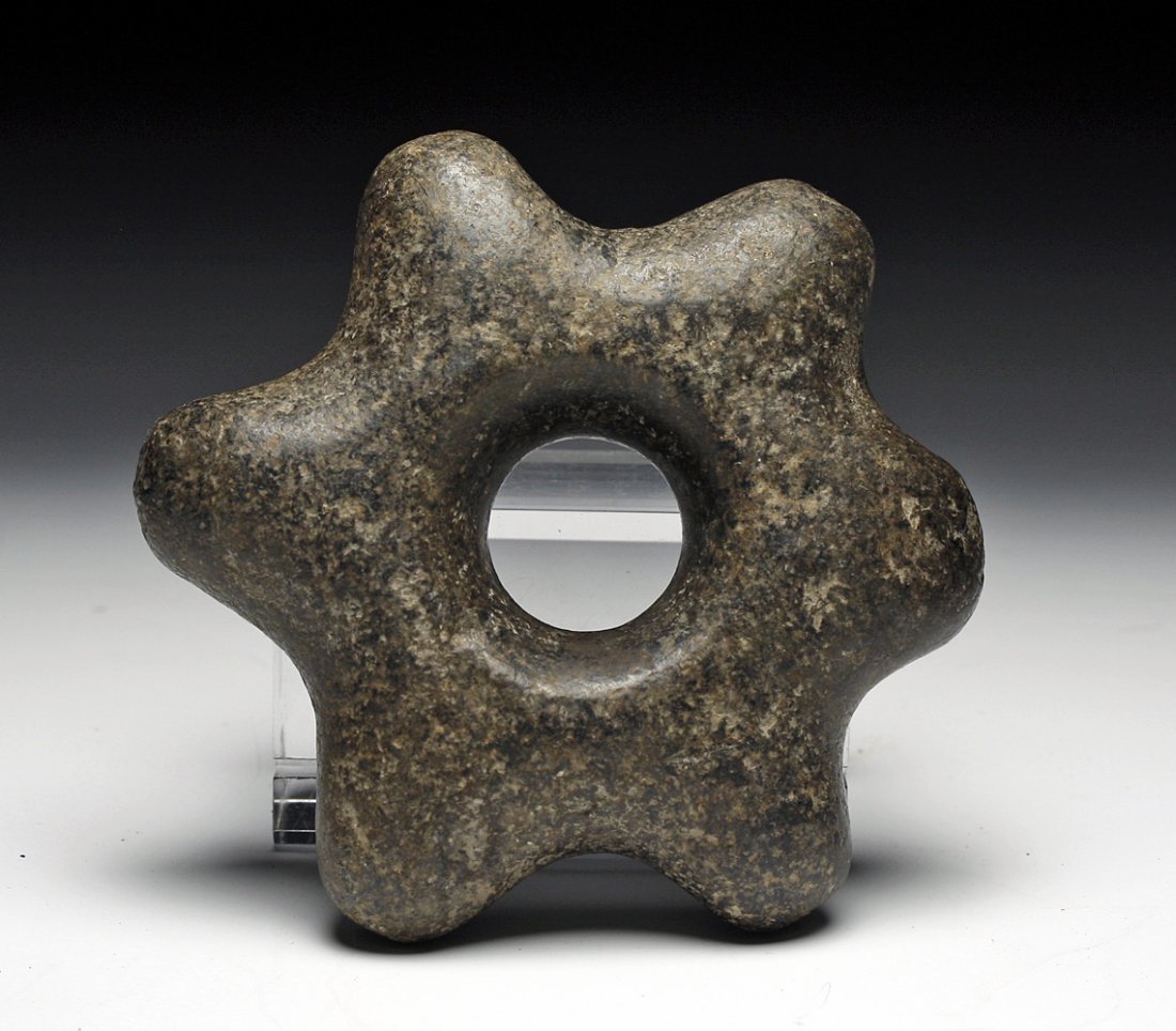 Chavin Miniature Stone Mace Head (1): Pre-Columbian, Northern Peru, Chavin, Ca 1100 to 500 BCE. Medium-sized carved stone mace head, certainly ceremonial in nature due to its size, with 6 extending nodes and small central shaft hole. 3-1/