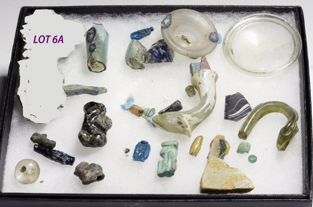 Mixed Lot of Ancient Glass, ex-Philip Mitry: Egypt and Roman Empire, Ca 1500 to 300 CE. Interesting study group of ancient glass - some fragments, some complete amulets. Group includes an Amarna period blue amulet and several beads, Late Dynasti