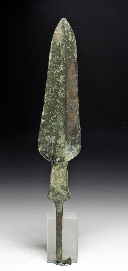 Ancient Luristan Bronze Spear Blade: Northwest Iran, Ca 1000 to 800 BCE. Luristan culture, nice molded bronze spear blade with tapering blood ridge down the center, and hooked barb for attachment to wooden shaft. 10-3/4"L PROVENANCE: EX-