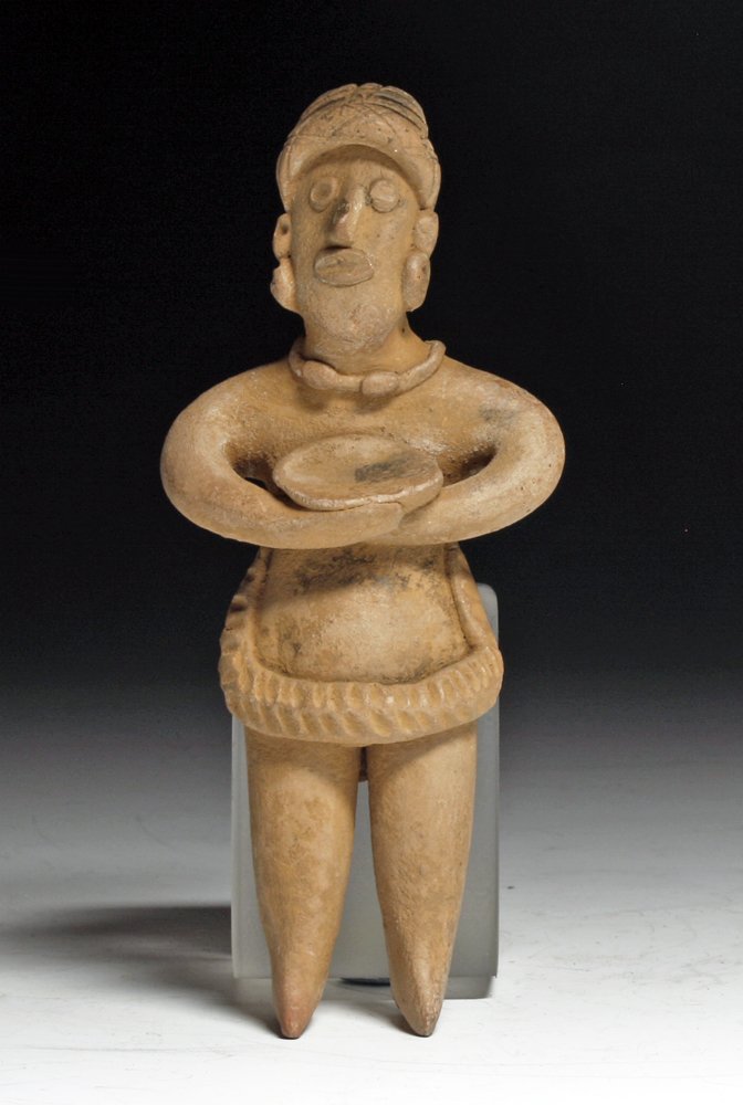 Pre-Columbian Colima Pottery Flat: Colima, west Mexico, Ca 200 BCE to 200 CE. Fine pottery flat female, hands to chest holding small bowl, and wearing sash around her front and stone necklace. 4-5/8" H PROVENANCE: EX-Private AZ collect