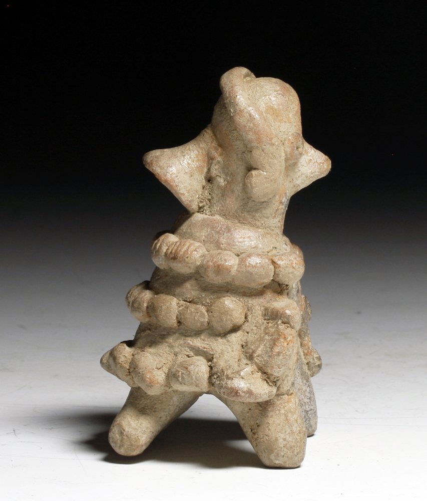 Pre-Columbian Colima Pottery Whistle: Colima, west Mexico, Ca 200 BCE to 200 CE. A very sweet pottery whistle in the form of a man transforming into bird. Three rows of attached pottery beads to indicated a feathered robe. 3" H. Whistle f