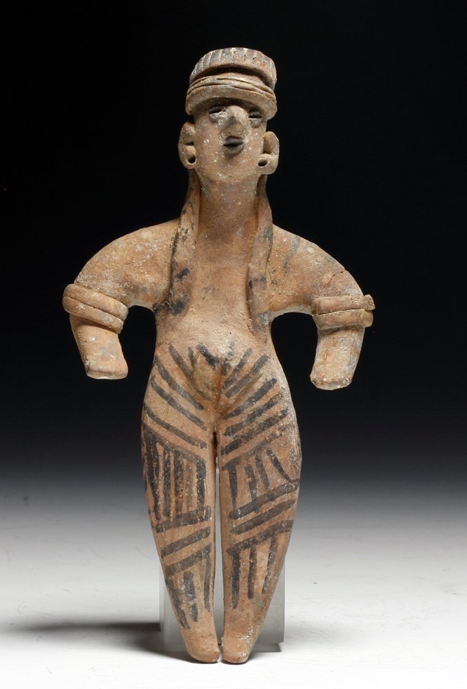 Large Pre-Columbian Colima Pottery Flat: Colima, west Mexico, Ca 200 BCE to 200 CE. Fine and large pottery flat female, with hands to front, decorated with black decoration on legs, long straight hair and large headdress. 6-3/4" H PROVENANCE
