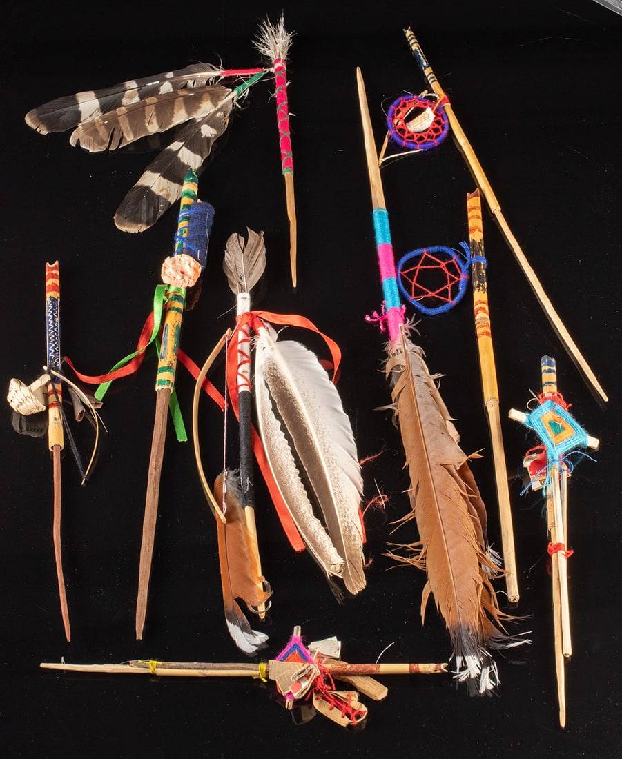 Nine Huichol Healing Arrows w/ Feathers, Yarn, & Paint: **First Time At Auction** Latin America, Mexico, Huichol or Wixarika People, ca. 2000 CE. A vibrant ensemble of nine Huichol healing or prayer arrows (known as muvieri), each imbued with symbolic mate