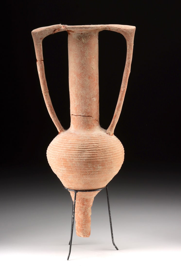 Roman Redware Amphora Used for Wine, Oil, or Garum Transport: Roman, Imperial period, ca. 1st to 3rd century CE. A utilitarian vessel built for ancient commerce, this Roman amphora exhibits the distinctive features of transport amphorae used throughout the Empir