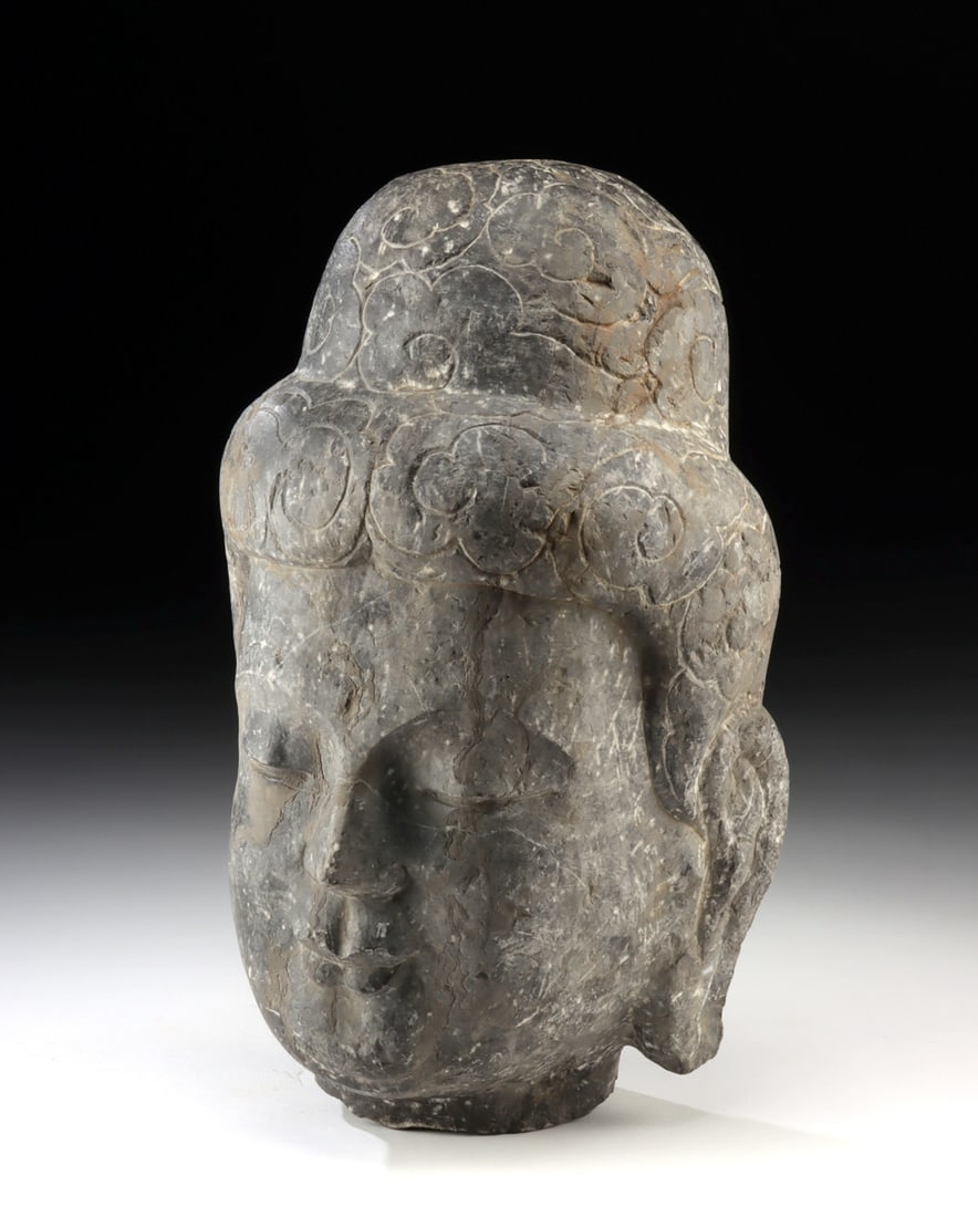 Chinese Ming Dynasty Schist Head of Guanyin: East Asia, China, Ming Dynasty, ca. 1368 to 1644 CE. A finely carved schist head of Guanyin (Avalokiteshvara), the bodhisattva of compassion, presented with softly modeled facial features, closed eyes
