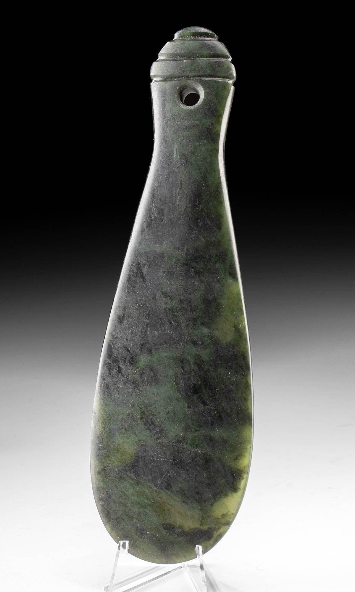 Early Maori Nephrite Jade Mere Pounamu (Hand Club): New Zealand, indigenous Polynesia, Maori culture, ca. late 19th to early 20th century CE. A prestigious and finely carved mere pounamu, the quintessential Maori weapon of chieftainship, shaped from hi