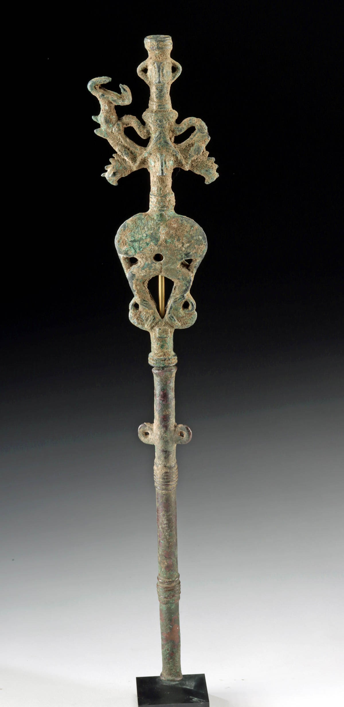 Luristan Master of Animals Standard (2 pcs): Ancient Near East, modern day Iran, Luristan, ca. 1000 to 700 BCE. A bronze hollow tubular standard in the form of a "master of animals", rendered as a rod between the heads and necks of stylized snar