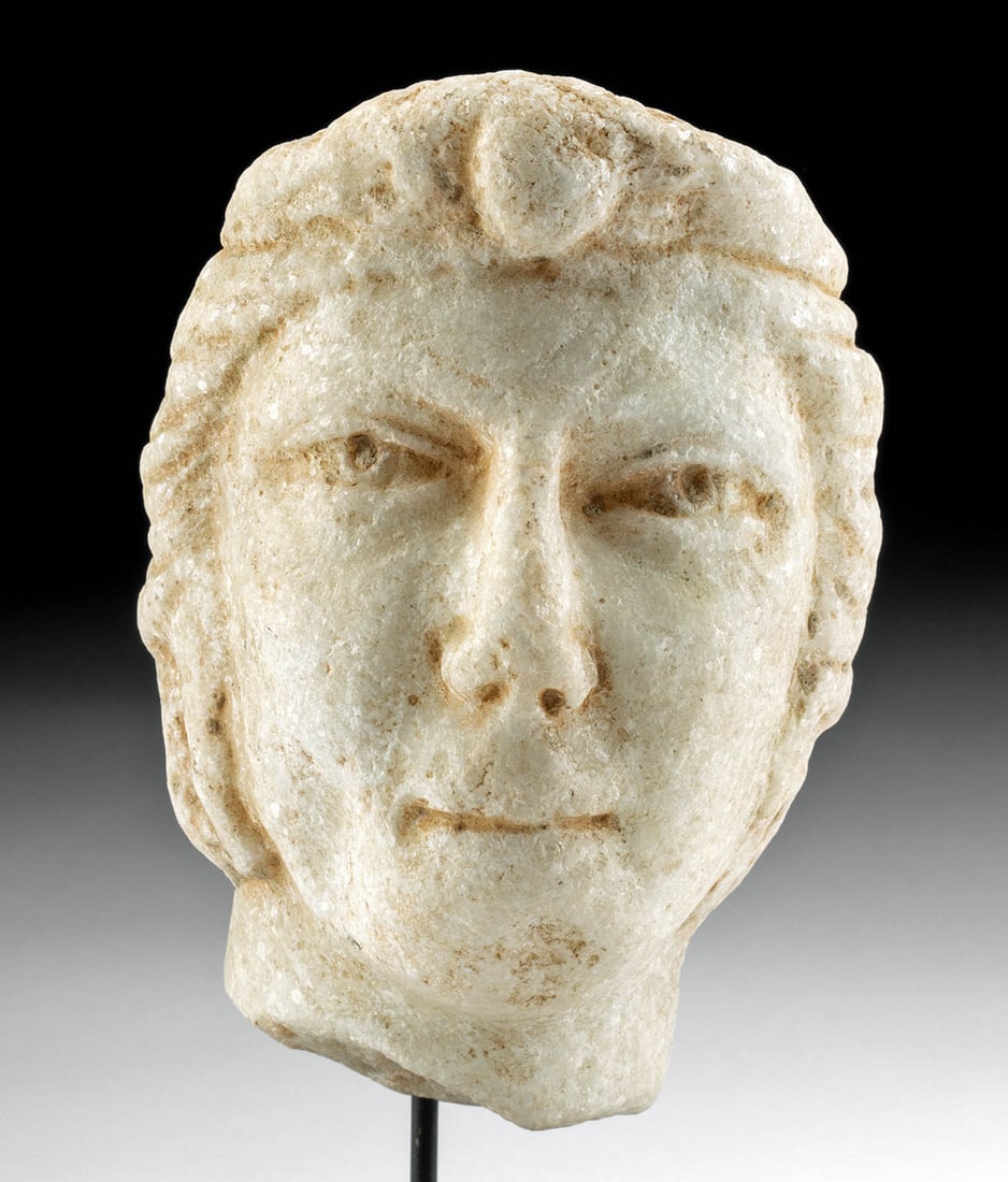 English / French Neoclassical Marble Head of a Woman: **Originally Listed At $500** Western Europe, probably England or France, Neoclassical Period, ca. early 19th century CE. A skillfully carved marble head of a female presenting an austere visage with